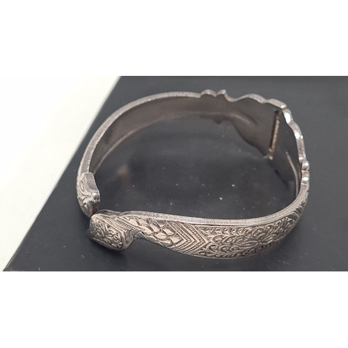 489 - White metal bangle marked S on both sections measures 7cm across