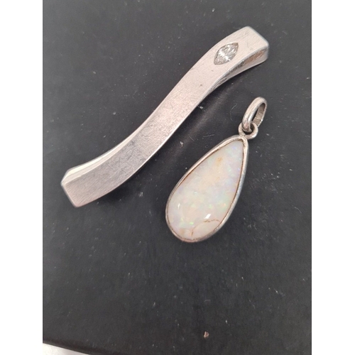 510 - Pair of silver pendants one with opal setting