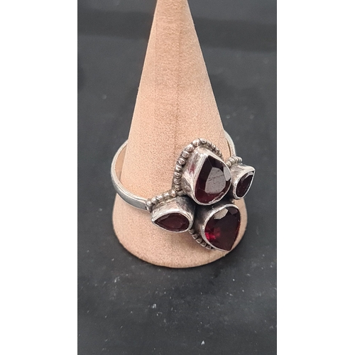 568 - 925 Silver ring with a dark red teardrop gemstone setting. Size U