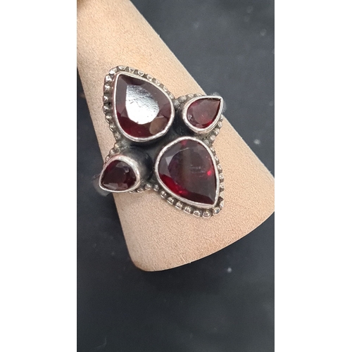 568 - 925 Silver ring with a dark red teardrop gemstone setting. Size U