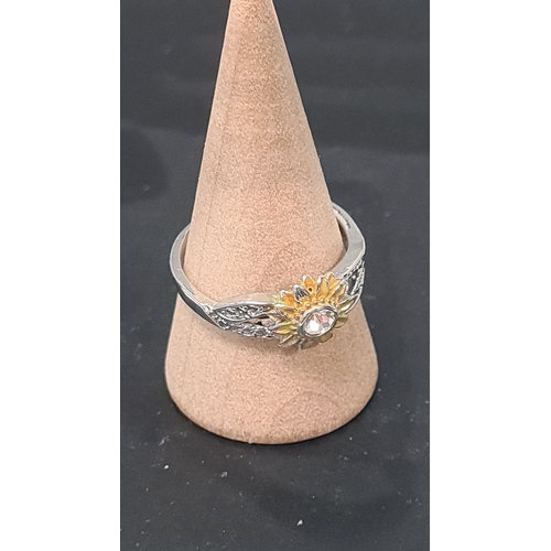 569 - 925 Silver ring with sunflower design and diamante setting. Size P