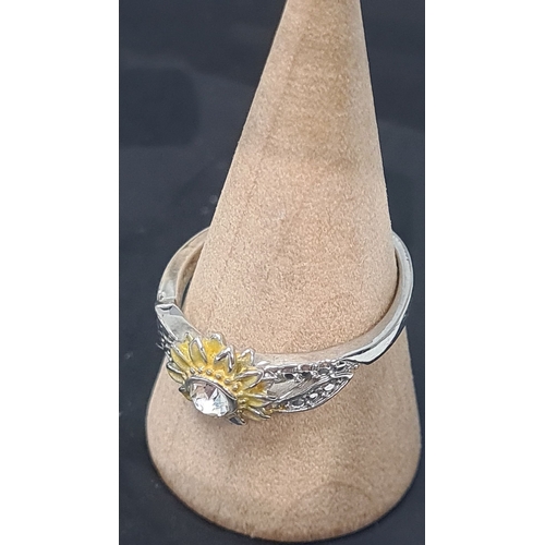 569 - 925 Silver ring with sunflower design and diamante setting. Size P