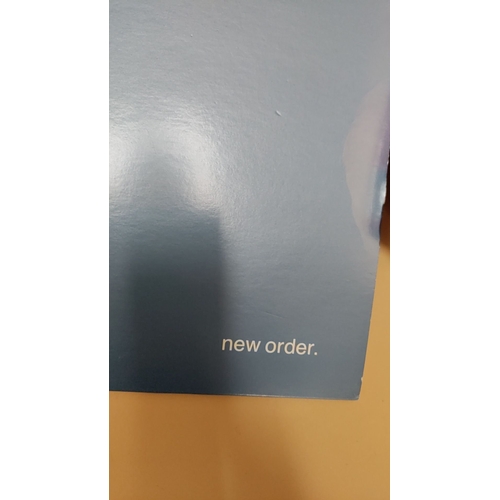 559 - 12 inch coloured vinyl record New Order Be A Rebel