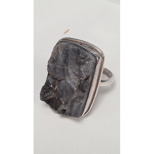 597 - 925 Silver ring with large grey statement gemstone. Size O