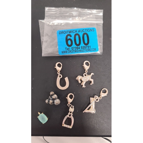 600 - Selection of white metal charms, including horse related charms