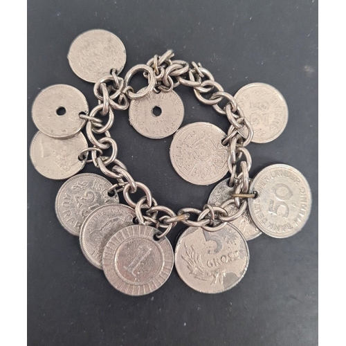 601 - White metal mixed coin bracelet. 6cm diameter