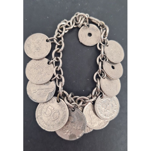 601 - White metal mixed coin bracelet. 6cm diameter