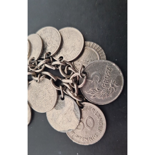 601 - White metal mixed coin bracelet. 6cm diameter