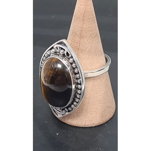 603 - 925 silver statement ring with tiger eye stone.  Adjustable