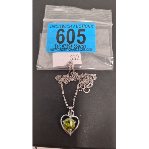 605 - Peridot stone with heart pendant on 925 silver chain. 44cm