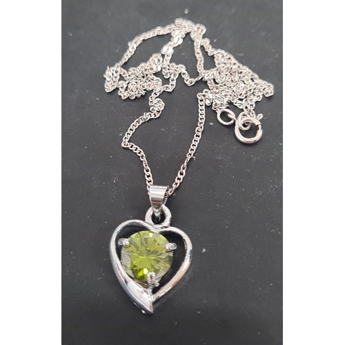 605 - Peridot stone with heart pendant on 925 silver chain. 44cm