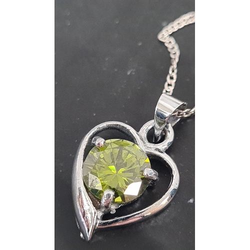 605 - Peridot stone with heart pendant on 925 silver chain. 44cm