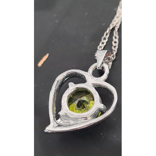 605 - Peridot stone with heart pendant on 925 silver chain. 44cm