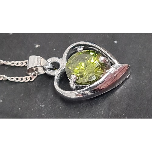 605 - Peridot stone with heart pendant on 925 silver chain. 44cm