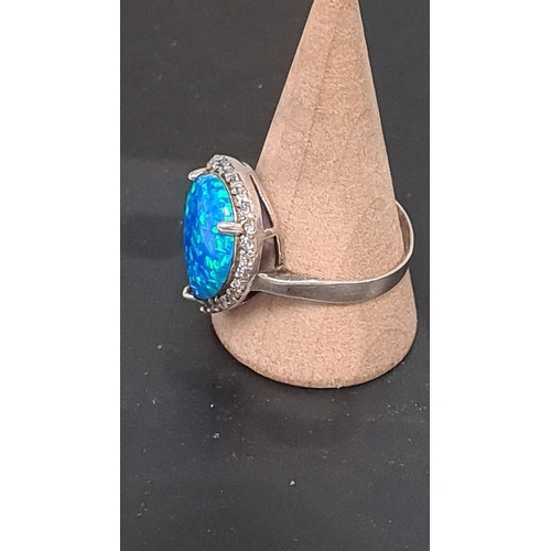 606 - white metal ring with teardrop blue opal style stone. Size U+