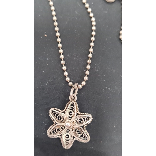 623 - 925 Silver chain with a filigree flower pendant. 40cm