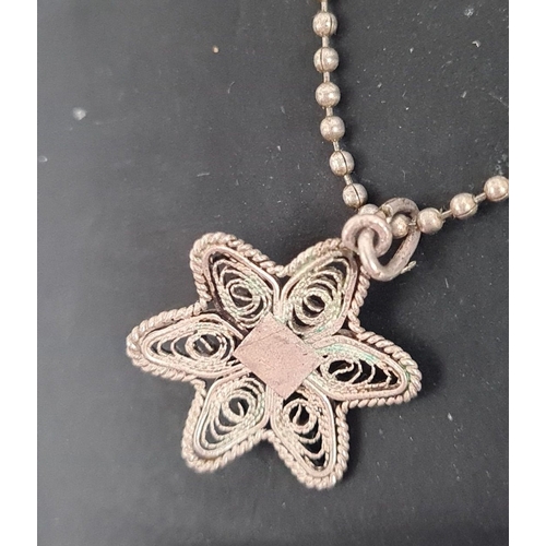 623 - 925 Silver chain with a filigree flower pendant. 40cm