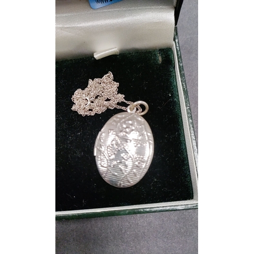 644 - 925 silver locket on silver chain 45cm long