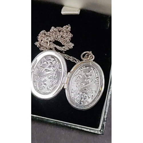 644 - 925 silver locket on silver chain 45cm long