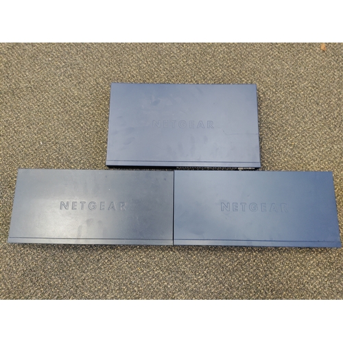 23 - Three Netgear network switches from an office clearance