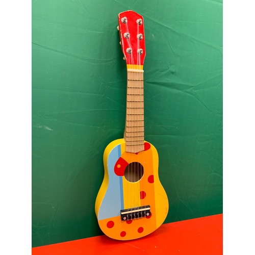 35 - Childs guitar with image of giraffe. Approximately 54cm x 18cm