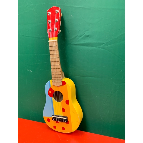 35 - Childs guitar with image of giraffe. Approximately 54cm x 18cm