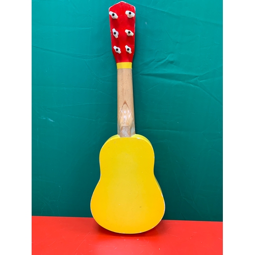 35 - Childs guitar with image of giraffe. Approximately 54cm x 18cm