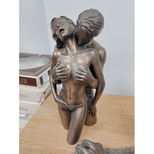 65 - A pair of cold cast bronze erotic figurines