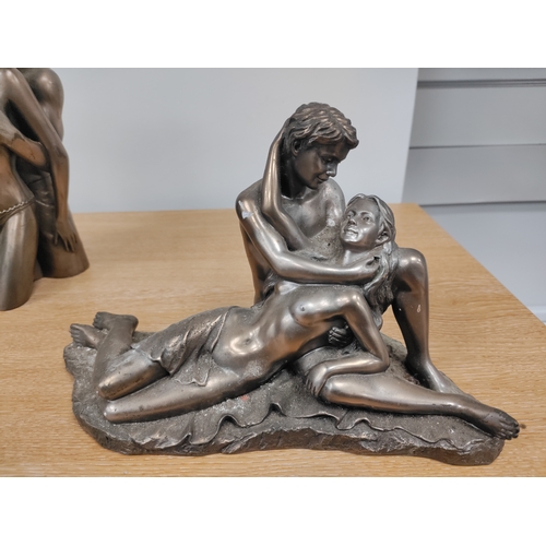 65 - A pair of cold cast bronze erotic figurines