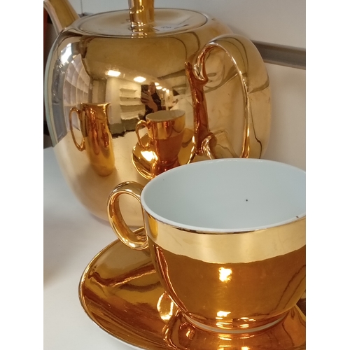 75 - Royal Worcester true porcelain gold lustre ware teapot, cup, saucer & milk jug