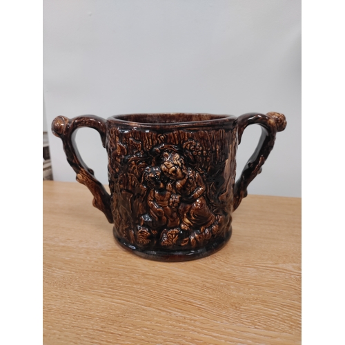 99 - Victorian Staffordshire Treacle Glaze Loving Cup. H 12cm x W 23.5cm