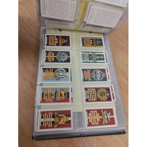 106 - A binder full of cigarette cards and two frames of cigarette cards