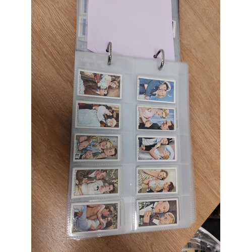 106 - A binder full of cigarette cards and two frames of cigarette cards