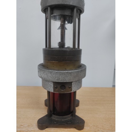 117 - An antique Spiralarm Type 'S' miners parafin lamp. With red lens. Made by S J. H. Nailer Ltd. H 38cm... 