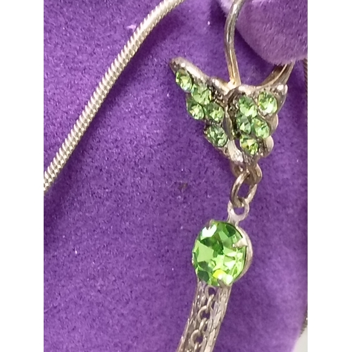 17 - White metal vintage green gemstone butterfly pendant on chain with matching lever back dangle earrin... 