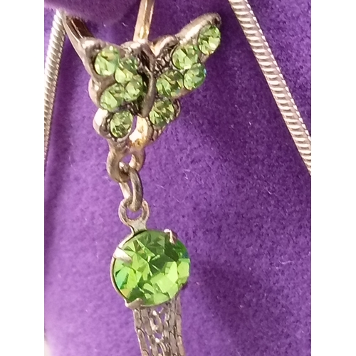 17 - White metal vintage green gemstone butterfly pendant on chain with matching lever back dangle earrin... 