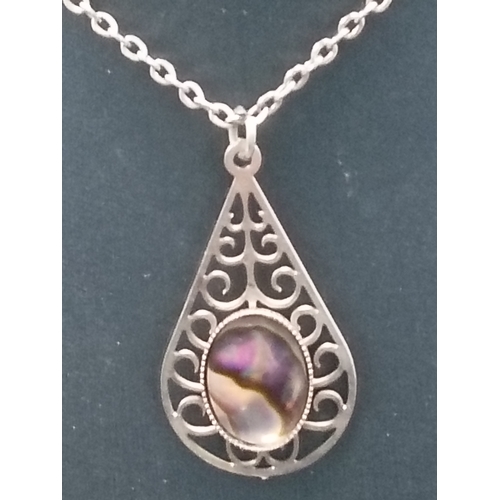 26 - White metal Abalone shell and scrolled pattern pendant on chain L 42cm