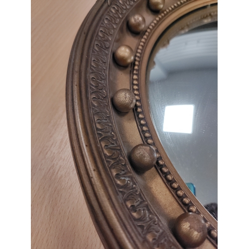 79 - Gomme Furniture gold guilt ships porthole style frame with convex mirror. Diameter 42cm.