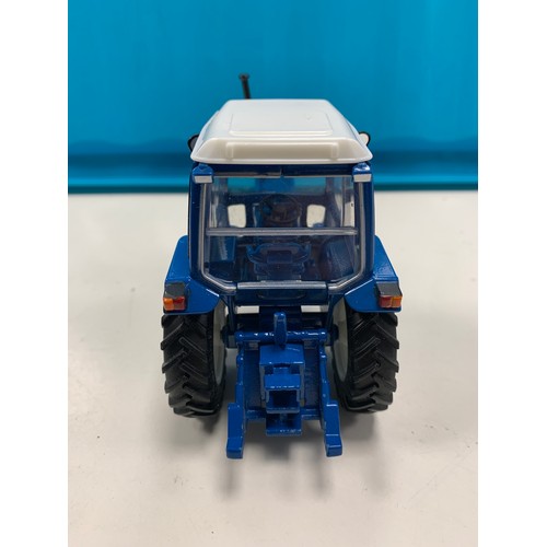 94 - A model of Thunderbird 1 and a die cast model Ford 6600 tractor. 

The Thunderbird 1 model is a 1:72... 