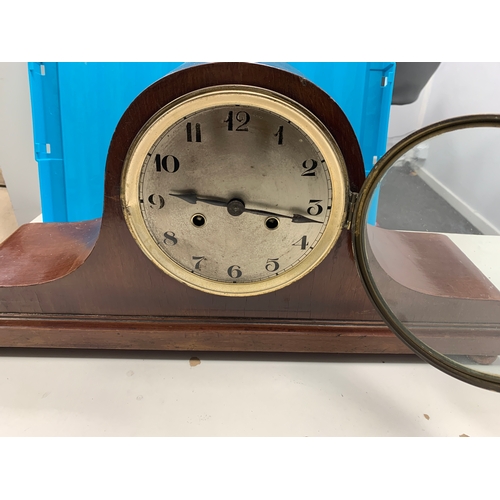 130 - Large mantle clock  l52cm x w13.5cm x h25cm. Wooden case, with brass surround.