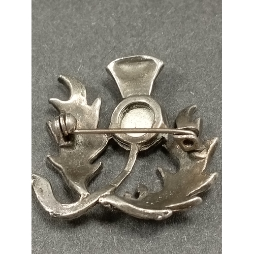 38 - White metal and citrine colour stone thistle brooch