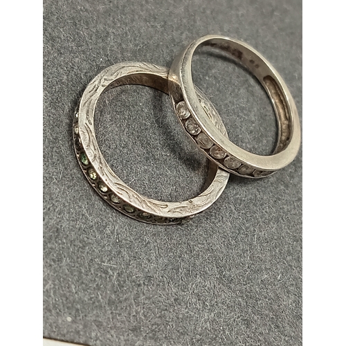 52 - 925 silver pair of diamanté stone band rings Sizes Q and R