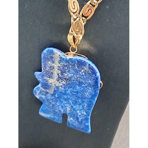 54 - Lapis lazuli Elephant pendant 3.5cm on a yellow metal chain 46cm