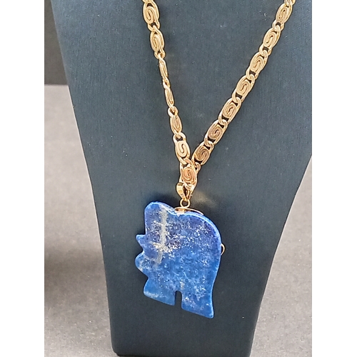 54 - Lapis lazuli Elephant pendant 3.5cm on a yellow metal chain 46cm