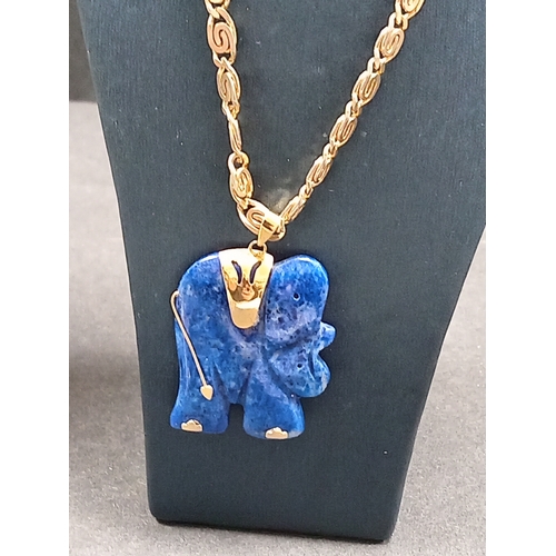 54 - Lapis lazuli Elephant pendant 3.5cm on a yellow metal chain 46cm