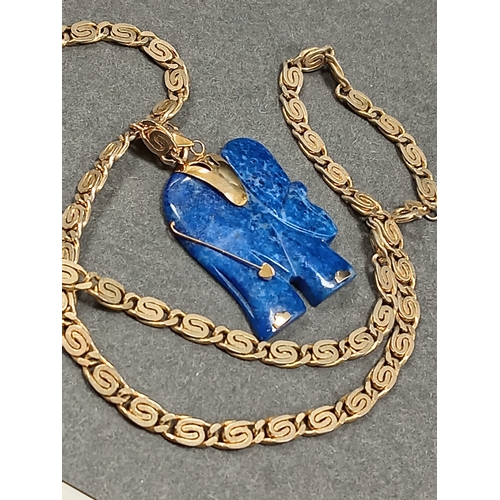 54 - Lapis lazuli Elephant pendant 3.5cm on a yellow metal chain 46cm