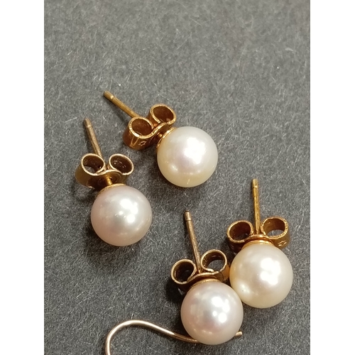 403 - Three pairs of 9ct gold and faux pearl earrings weight 4.55 grams