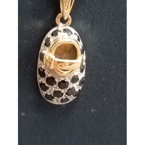 406 - 9ct gold sapphire and clear gemstone baby bootie pendant on 9ct gold chain 48cm weight 3.68 grams