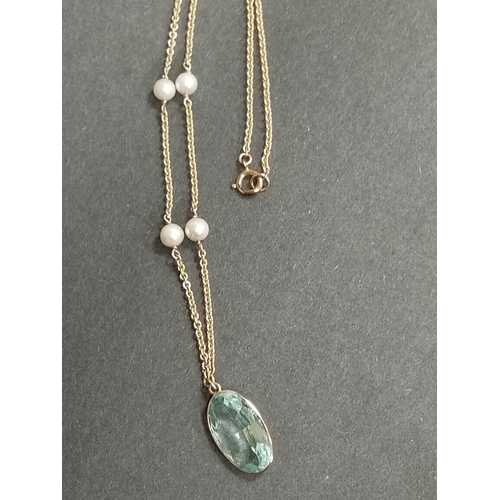 415 - 9ct gold large aquamarine coloured pendant on 40cm 9ct gold and faux pearl pendant 9.01 grams