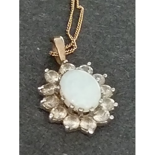 399 - 9ct gold opal and clear stone pendant on 9ct gold chain 40cm weight 1.68 grams